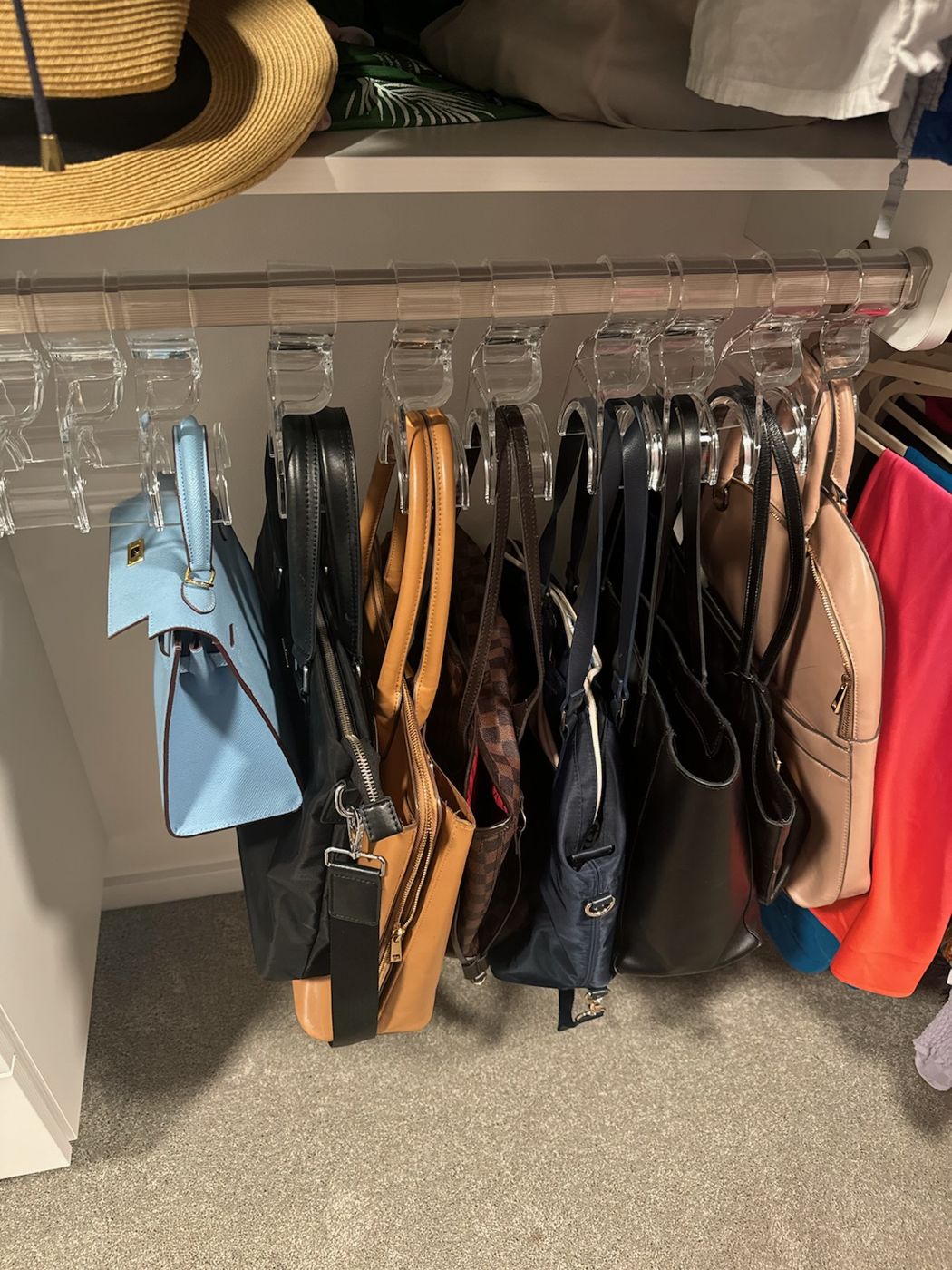 Organized closet with a purse rack