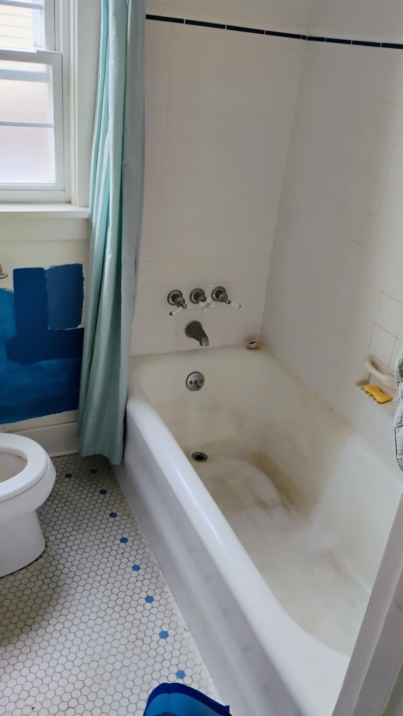 Bathtub before: stained and dull